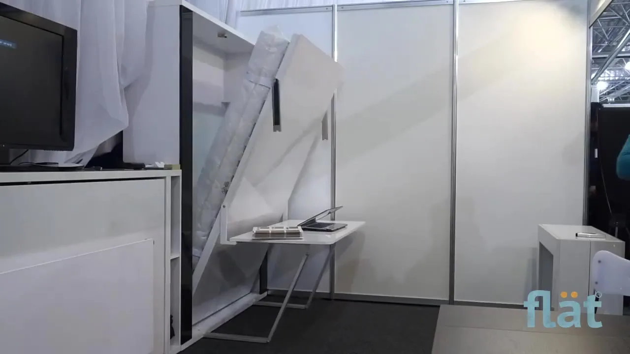 A closed horizontal bed with a shelf on its front, flät stand
